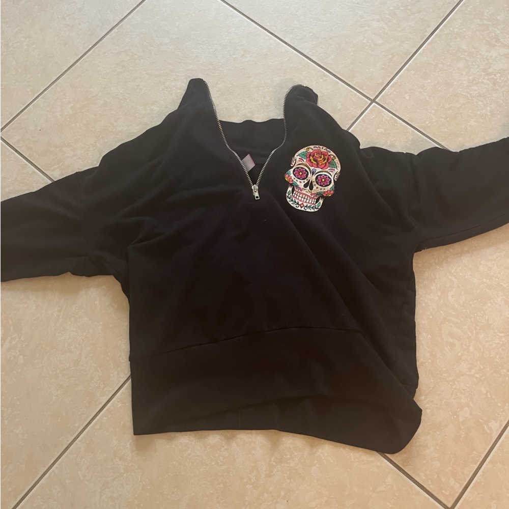 Black jacket with skull and love on the arms
